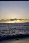 Sailboat at sunset at Kaanapali beach.